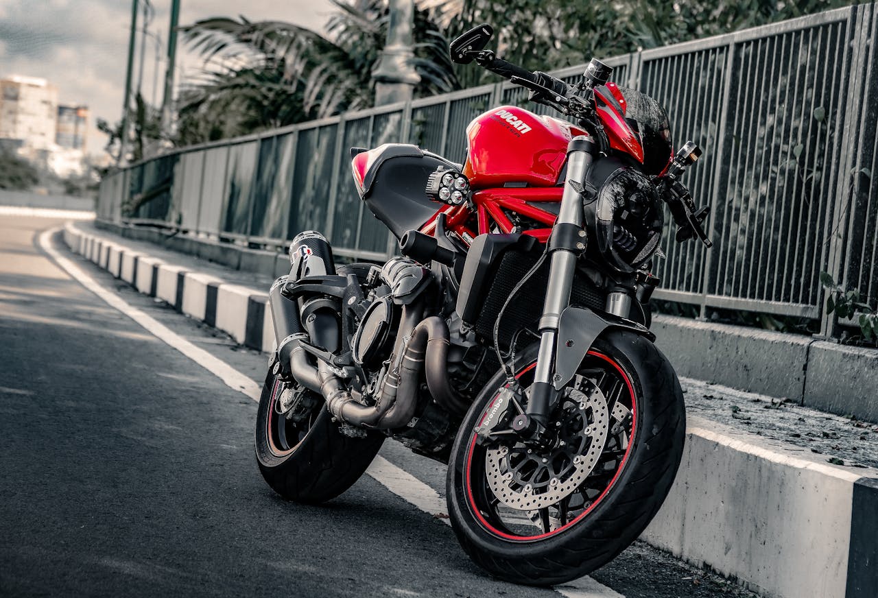 Red Motorcycle Parked on Roadside